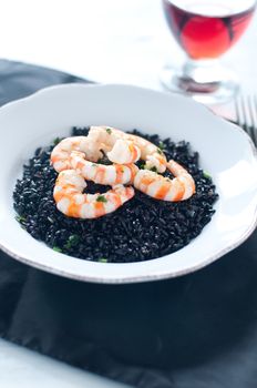 Black rice with prawns fresh, italy