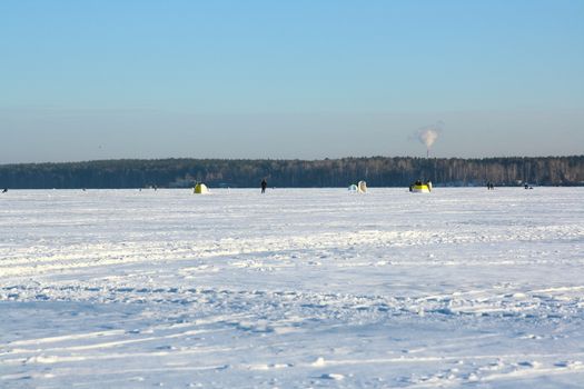 Fishermans on ice for fishing with equipments