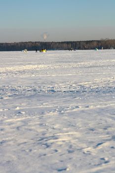 Fishermans on ice for fishing with equipments