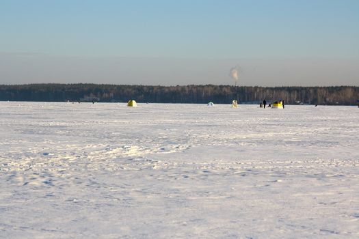 Fishermans on ice for fishing with equipments