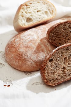 Farm still life. Freshness bread set on white tablecloth