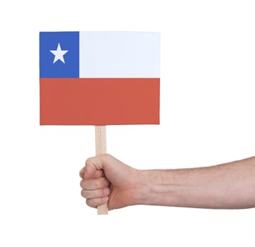 Hand holding small card, isolated on white - Flag of Chile