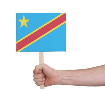 Hand holding small card, isolated on white - Flag of Congo