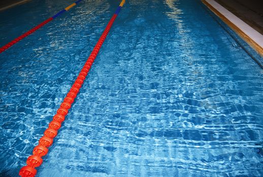 Swimming pool with lane markers. Horizontal photo