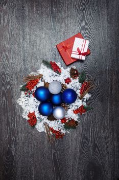 Christmas wreath and toys on a hardwood background