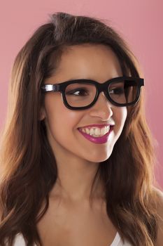 Beautiful casual woman over a pink background.