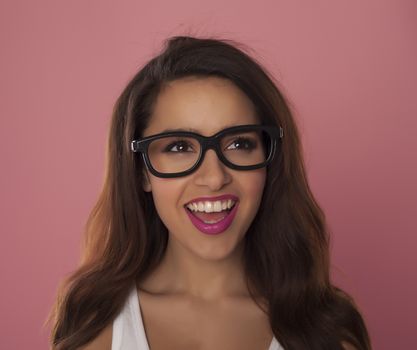 Beautiful model over pink background.