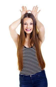 Casual young woman over a white background.