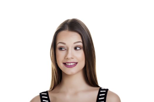 Casual young woman over a white background.