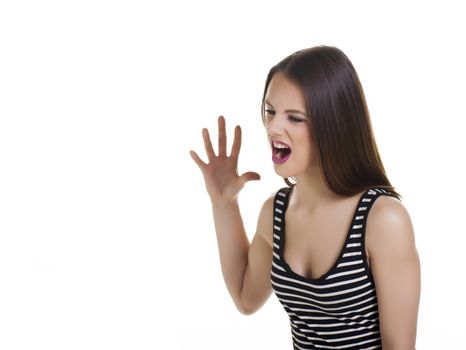 Woman shouting in anger over a white background.