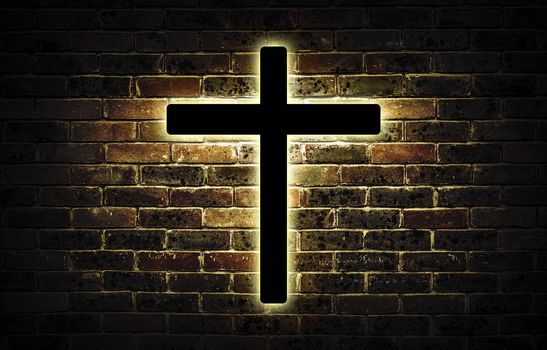 Wooden crucifix hanging on a brick wall.