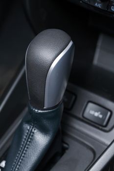 Modern car interior. Closeup of gear lever
