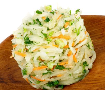 Delicious Salad with Sauerkraut, Spring Onion, Dill and Carrot on Wooden Plate closeup on White background