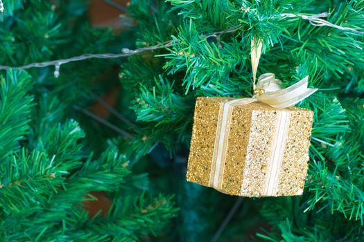 Gold Christmas background of de-focused lights with decorated tree, Christmas background 