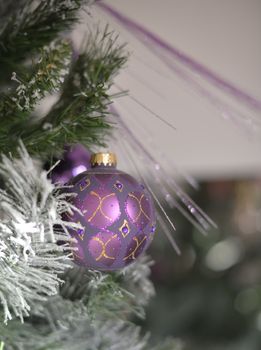 Background with snowy fur tree branch and Christmas balls.