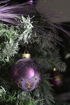 Background with snowy fur tree branch and Christmas balls.