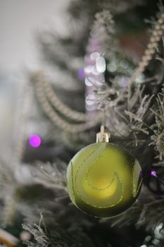 Background with snowy fur tree branch and Christmas balls.