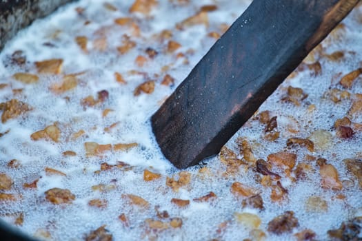 Traditional lard cooking in cold season