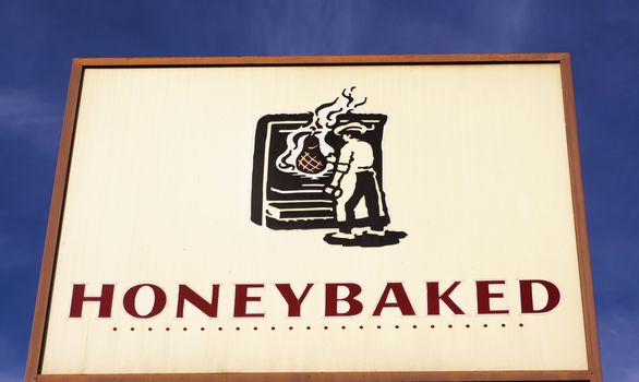 LOS ANGELES, CA/USA - December 6, 2015: HoneyBaked Ham restaurant sign and logo. HoneyBaked Ham is a food retailer founded in 1957.