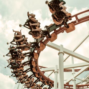 Rollercoaster ride with sky at theme park