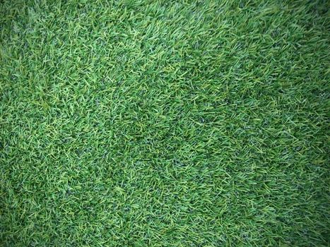 Green artificial grass soccer field