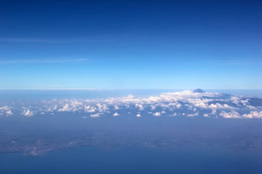 Soft clouds over view from airplane flying