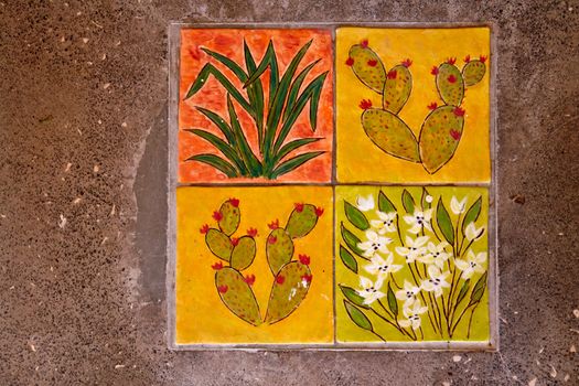 Creative hand pained ceramic tiles with a selection of leaves