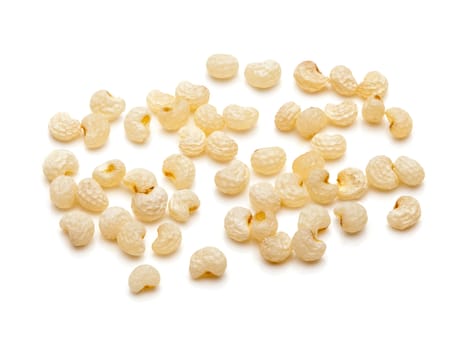 Macro closeup of Organic White Poppy seeds (Papaver somniferum) isolated on white background.