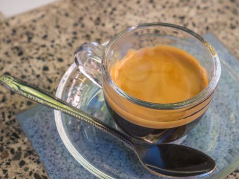 Coffee cup and saucer on table background.