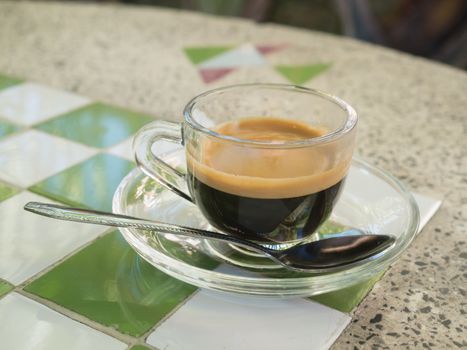 Coffee cup and saucer on table background.