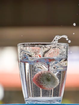 Strawberry Water splash in glass