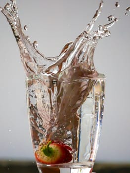 Strawberry Water splash in glass