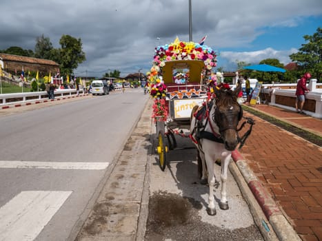 Lampang - December 5 : Don Muang Airport on December 5 , 2015 People in holiday  travel which horse carriage in temple Phrathat Lampang Luang in Lampang, Thailand Thailand.