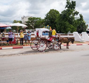 Lampang - December 5 : Don Muang Airport on December 5 , 2015 People in holiday  travel which horse carriage in temple Phrathat Lampang Luang in Lampang, Thailand Thailand.