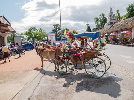 Lampang - December 5 : Don Muang Airport on December 5 , 2015 People in holiday  travel which horse carriage in temple Phrathat Lampang Luang in Lampang, Thailand Thailand.