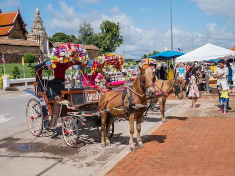 Lampang - December 5 : Don Muang Airport on December 5 , 2015 People in holiday  travel which horse carriage in temple Phrathat Lampang Luang in Lampang, Thailand Thailand.