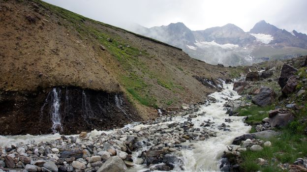 River at Greater Caucasus Mountain Range, North Osetia, Russia                  