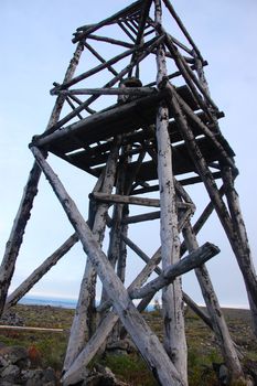 Timber triangulation tower at tundra, Chersky region, Yakutia, Russia