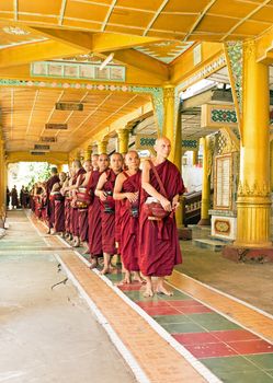 BAGO, MYANMAR -November 26, 2015: Monks going for lunch in the monastery from Bago in Myanmar.
Buddhism in Myanmar is predominantly of the Theravada tradition, practised by 89% of the country's population. It is the most religious Buddhist country in terms of the proportion of monks in the population and proportion of income spent on religion