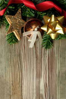 Christmas background with tree branches and decorations on wood with space 
