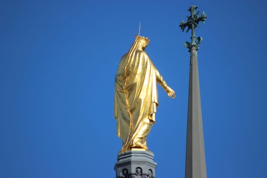 Closeup of the Golden Statue of the Virgin Mary (back view). Basilica of Notre-Dame de Fourviere in Lyon,