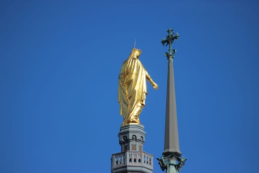 Golden Statue of the Virgin Mary (back view). Basilica of Notre-Dame de Fourviere in Lyon,