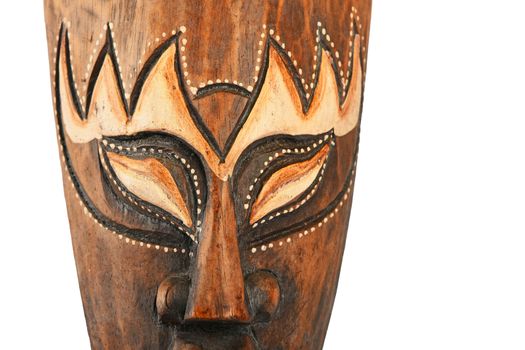 Asian traditional wooden painted brown mask with face of human or demon close up isolated on white