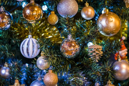 Close up of a decorated Christmas Tree with Baubles and other colourful decorations.