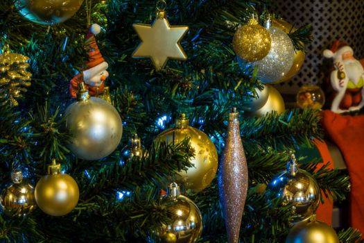 Close up of a decorated Christmas Tree with Baubles and other colourful decorations.