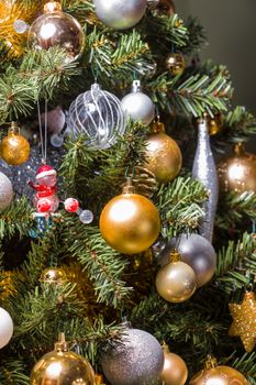 Close up of a decorated Christmas Tree with Baubles and other colourful decorations.