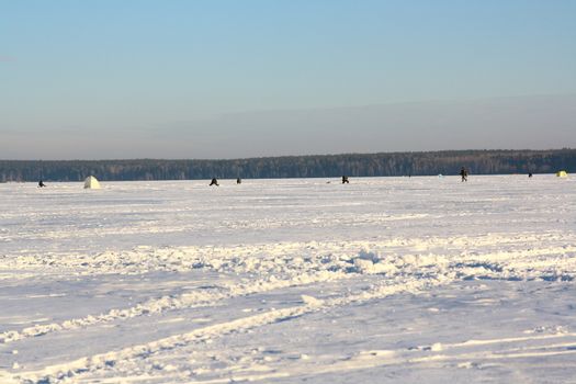 Fishermans on ice for fishing with equipments