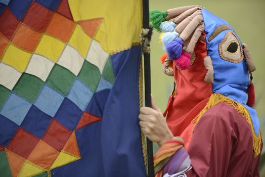 Cochasqui, Ecuador, - June 21, 2013.
Indian man in traditional holiday costume is taking part in solstice holiday celebration.