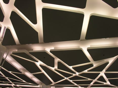 View of a suspended futuristic ceiling with modern lighting