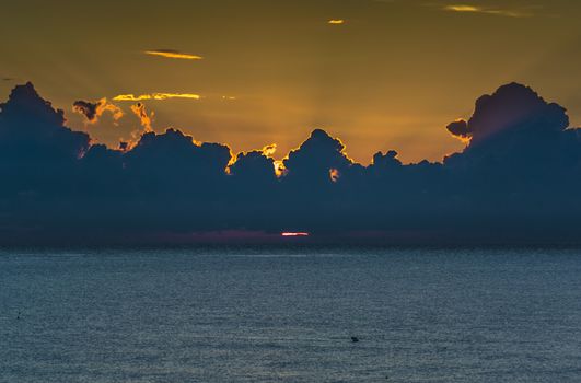 a cloudy sunrise at sea